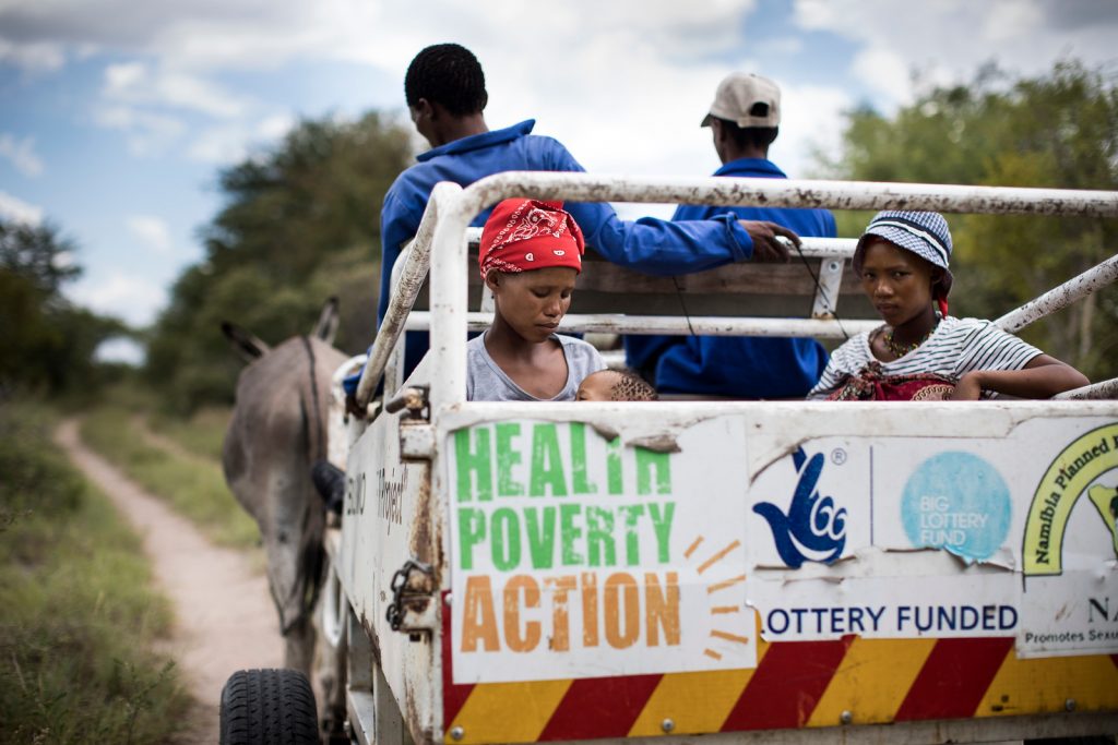 Xao (left) uses a donkey cart ambulance to reach the health centre. Donkey cart ambulances are often the only transportation that can navigate through the difficult terrain in Tsumkwe.