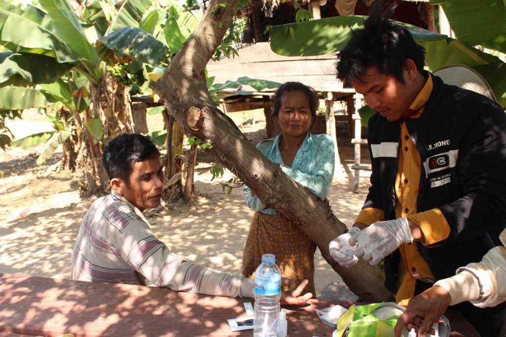 Taounsay tests a family for malaria